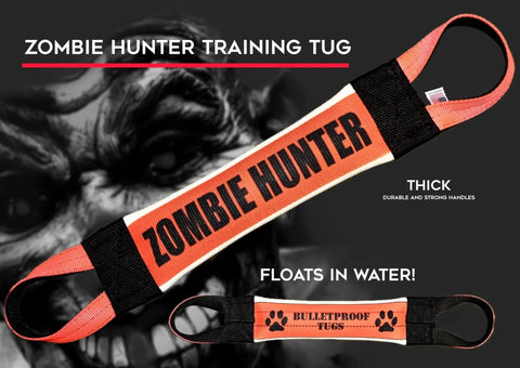 The Zombie Hunter Fire Hose Training Tug by Bulletproof Pet Products Inc features thick, durable black handles at both ends, floats in water, and showcases bold feature text. A blurred zombie face appears in the background.